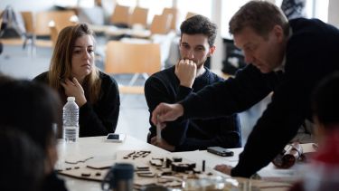 Students working on model