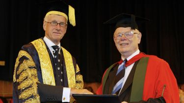 Former University Chancellor Sir Peter Middleton, presenting Dr Alan Kelly with his honorary degree