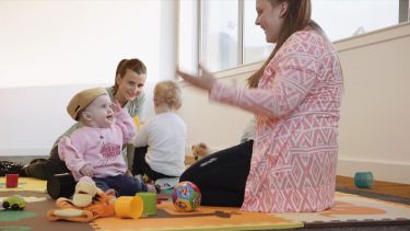 Parents learning about communicating with deaf babies and toddlers