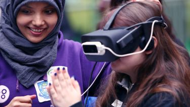 A girl tries out virtual reality with a headset at Science Alive 2017.