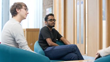 Students relaxing in Geography and Planning Building