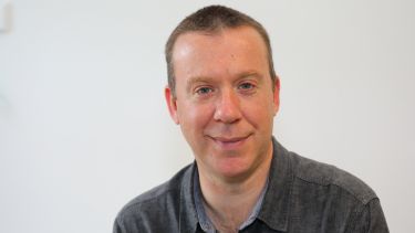 A profile photograph of Mark Bradley. 