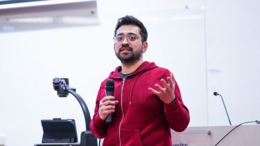 An Information School lecturer presenting.