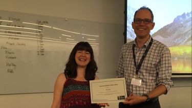 A member of the Bateson Centre being presented with the Caroline Butcher Award by the Bateson Centre Director