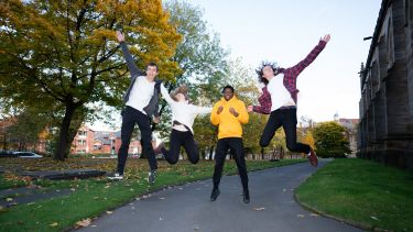 Student jumping for joy