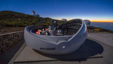 Professors Vik Dhillon and Dave Petley with other attendees standing in the GOTO dome on La Palma.