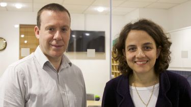 Staff members Mark Bradley and Irini Katsirea smiling into the camera.
