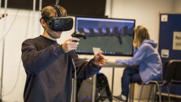 students testing out virtual reality in the lab