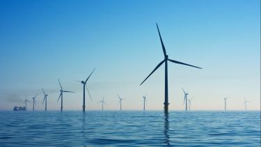 A number of wind turbines in the sea