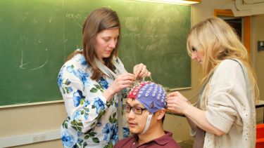 Liz Milne and Megan Freeth using an EEG machine