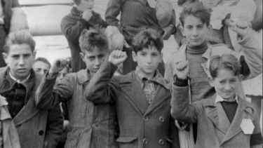 A restored photograph of children in the Spanish War.