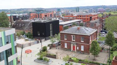 An view of the red-brick HRI building as taken from the roof of an adjacent building