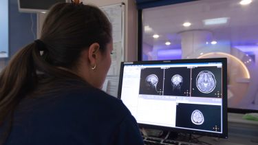 A Psychology PhD student works with MRI
