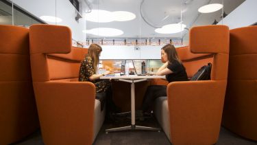 An image of students studying in a pod in The Diamond building.