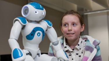 Picture of the Nao robot with girl