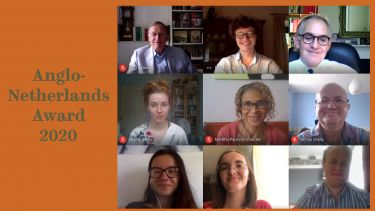 Students and staff with member of Anglo Netherlands society 