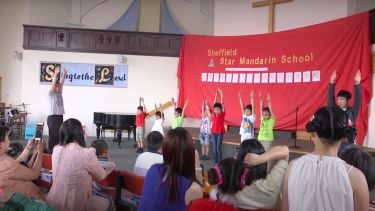 China Day student performance with parents watching