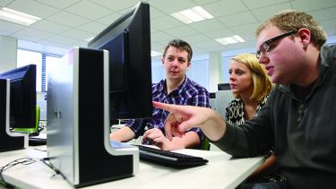 Students working together at a computer