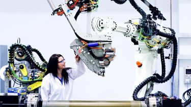 Engineer working with robotic machinery at the Advanced Manufacturing Research Centre