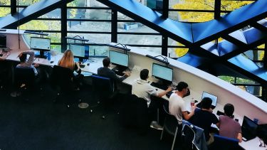 Students working on computers in a digital study space at The Diamond