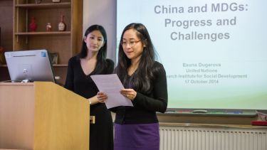 Two women presenting a China seminar