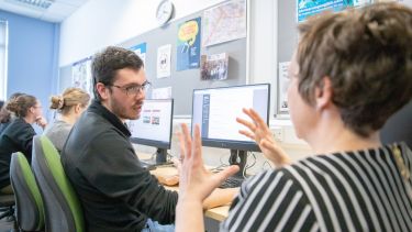 Tutor helping student