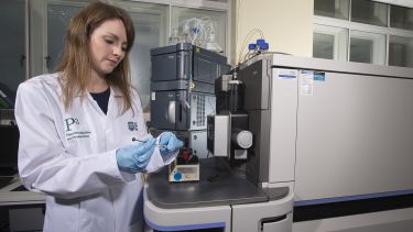 A member of staff carrying out mass spectrometry