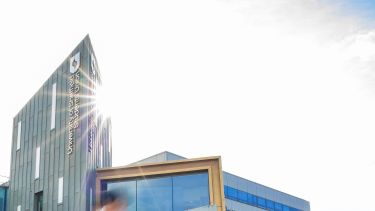 Image: Students' Union building and sunshine; Text: Community Sheffield made