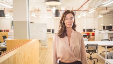 Business woman standing in modern office
