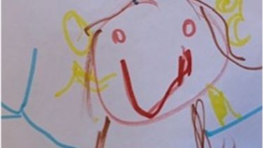 A drawing of a person in crayon