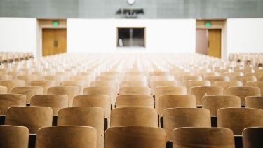 A university lecture hall with empty chairs