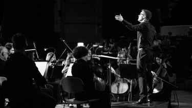 A conductor with an orchestra