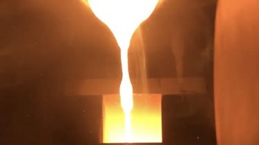 An image of steel being melted and cast into a mould