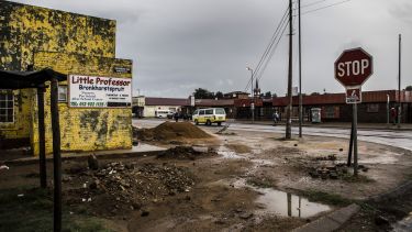 A road junction with stop sign in Bronkhorstspruit, South Africa in poor condition