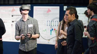 A person using VR at the Insigneo showcase.