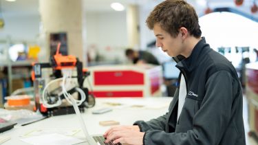 A student working at their laptop