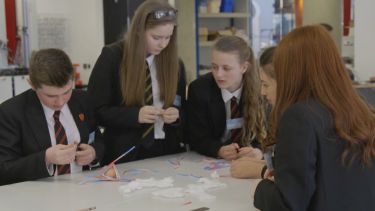 A group of secondary school students working on a task set by project sunbyte