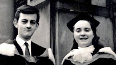 Black and white graduation photo 2 people smiling