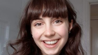 Student smiling at camera
