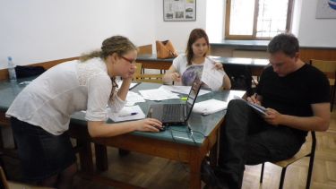 Three participants working together in the Advocate workshop