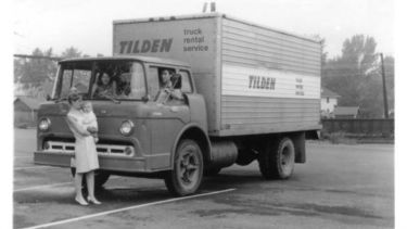 Family photograph in front of a Tilden truck