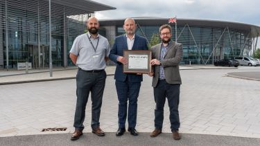 Staff received the Secured By Design award outside Factory 2050