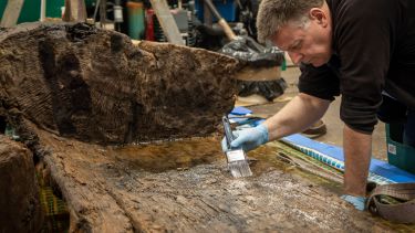 Ian Panter, Head of Conservation York Archaeological Trust with the coffin