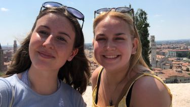 German students on Year Abroad with Austrian cityscape in background