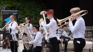 A student Brass Band performing at the Uni Brass event