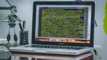 Laptop with programming code on the screen