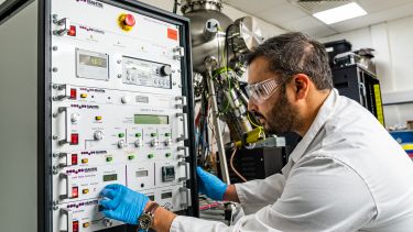 A dual-function deposition facility featuring sputtering and electron beam deposition 