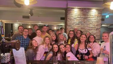A group of german students on a night out. some wearing German traditional clothes
