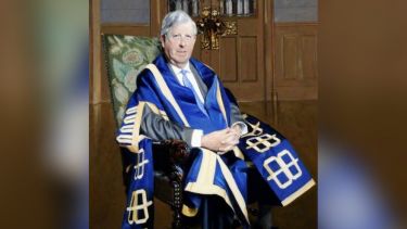 A painting of Peter Wilton Lee in his University of Sheffield robes