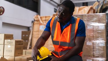 A person wearing high vis in a warehouse